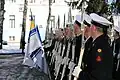 Members of the battalion rendering honors for a visiting military leader.