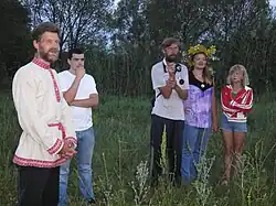 Image 71Russian farmer family in 2010, showing a mix of contemporary clothing and traditional folk costume elements. (from 2010s in fashion)