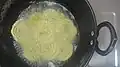 Preparation of chakri in hot oil