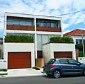 Cement rendered pavilion style semi-detached houses in Dover Heights