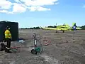 Fire bomber Airtractor 802 being reloaded at Orleans Farm (Tagon) airstrip, close to Cape Arid National Park, Esperance, November 2014.