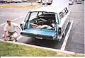 1966 Ford Country Sedan demonstrating that year's new Magic Doorgate that folds down...