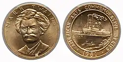 A gold medallion depicting a man and a steamship