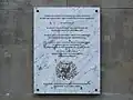 A commemorative plaque dedicated to the history of the building.