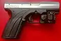 Customized two-tone Caracal C with Viridian C5L white tactical light/laser sight.