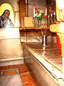 The slab marking the place where Jesus was laid to rest and resurrected in the Tomb or Edicule of the Church of the Holy Sepulchre in 2008