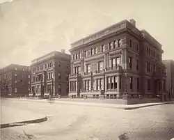 Three ornate three-story square mansions