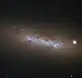 NGC 4248 is located about 24&nbsp;million light-years away.[24]