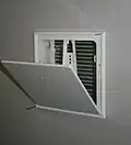 Air transfer damper mounted in wall