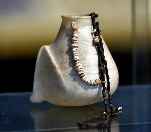 Alabaster vase and necklaces from Tell es-Sawwan, c. -6000 – -5800 National Museum of Iraq, Baghdad.