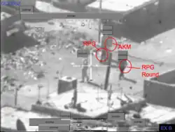 "Insurgents with RPG and AKM weapons"