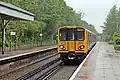 A Class 508 arrives with a service to Hooton.