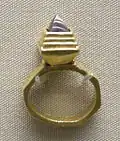 Gold finger ring with garnet inlay (BM)