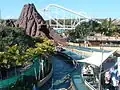Overview of Bermuda Triangle's station and final drop with the Corkscrew roller coaster in the background.