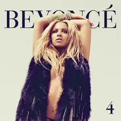 Beyoncé with her arms raised above her head, wearing a fur scarf