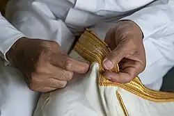 Image 7Bisht Being Sewn in Al-Ahsa (from Culture of Saudi Arabia)