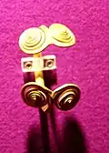 Double-volute ends Sacoșu Mare type. NMIR Museum Romania[55]
