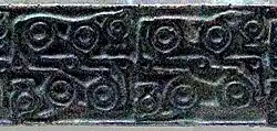 Motif of four horses in Animal style (Hilt of bronze dagger, early 8th Century BCE).[17]