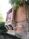 Masonry oriel window above a canal supported by corbelling, Bruges, Belgium