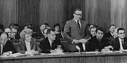 Minister of Education Margot Honecker listens as Assistant Secretary for Culture and Sport Roland Weissig addresses the 11th Council of State meeting in 1968.