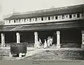Mandarins in mourning dress in the funeral of emperor Khải Định going out of the hall ,1925.