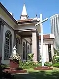 Statue of the Virgin Mary and Glorious Cross on the grounds of the cathedral.