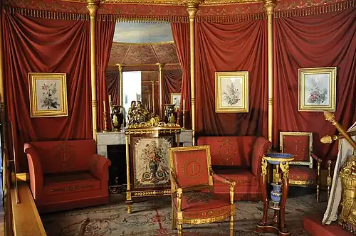 The Empire style chariot clocks aimed to decorate the mantel and console tables of palaces, mansions, etc., complementing the décor. Château de Malmaison, France.