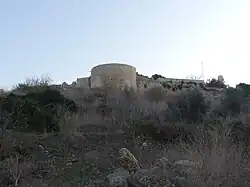 The northwestern tower with the shrine's minaret (right)