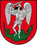 A coat of arms depicting an angel in full body armour and wings outspread while standing on a green dragon with a twisted tail