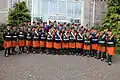 A family photo with the combined pipe bands.