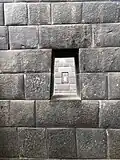 Original trapezoid windows inside the temple