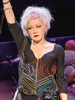 A waist-up picture of Dolly Parton.