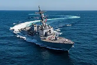 Flight III ship USS&nbsp;Jack H. Lucas showing the larger AN/SPY-6 arrays, stacked rigid-hull inflatable boats, and slight exhaust stack modifications