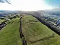 Wide-view format of Pen-toppen-ash on Kemeys Graig, showing the meandering River Usk to the right and Caerleon and Newport in the distance.