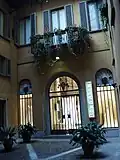 A courtyard showing a wedding-dress shop.