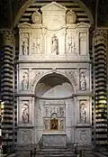 Piccolomini Altar by Andrea Bregno (1481–1485), with figures by Michelangelo (1504)