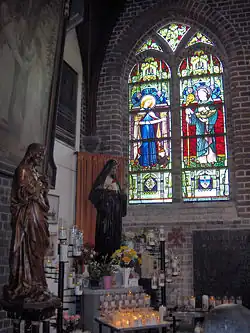 Chapel at the back of the Onze-Lieve-Vrouw-ter-Duinenkerk, Ostend, Belgium: stained glass representations of Saint Godelieve and Saint Idesbald