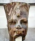 Amenhotep wearing the red crown of Lower Egypt, c. 1400 BCE. From Thebes, Egypt. British Museum. EA7