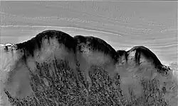 North Polar Scarp in Abalos Undae with Basal Exposure and Dunes in black and white