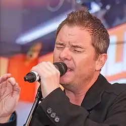Mortimer performing with East 17 during a promotional tour in Cologne, Germany in 2012