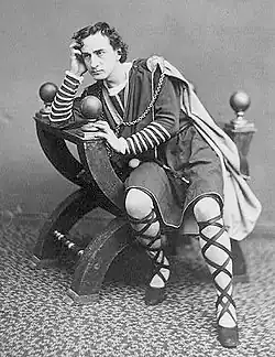 The American actor Edwin Booth as Hamlet, seated in a curule chair, c. 1870