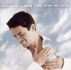 Close up of a man in a white shirt with the sky in the background.