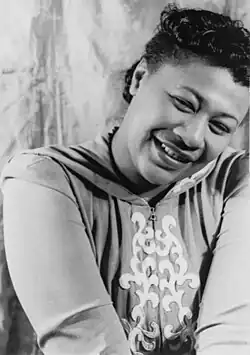 Black-and-white photograph of Fitzgerald, smiling at the camera.