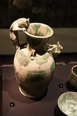 A ewer with lugs, a dragon-head spout, and a feline-shaped handle, possibly from North China (perhaps Hebei)
