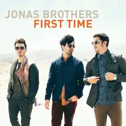 The three brothers walking wearing sunglasses, in a dessert-like setting