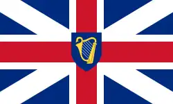 Red cross with a white border over a white saltire and dark blue background. At the centre is a gold harp in dark blue shield, which is the same size as the intersection of vertical and horizontal white bars.