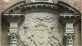Front door and portal of Gdańsk Town Hall. The heads of the lions are turned towards the Golden Gate, according to legend, they look for help from the Polish king.[7]