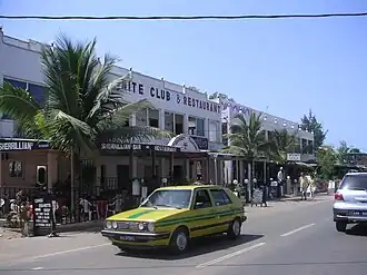 A building labelled "NITE CLUB & RESTAURANT" next to a two-way road