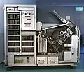 Front view of the Gamma 10 with its panel removed, showing the CPU and control panel on the left half