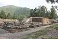 General view of the votive stupas and main stupa of Saidu Sharif